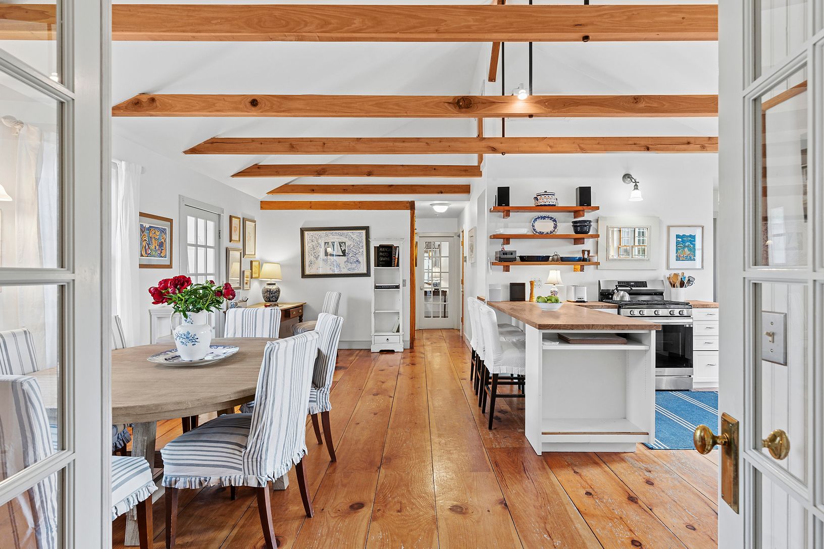   wide plank floors and open kitchen/ dining