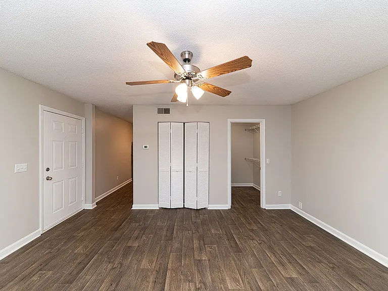 Spacious living room with hardwood-style flooring