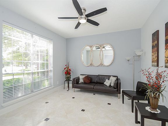 Former Living room with tile floors & decorative inserts