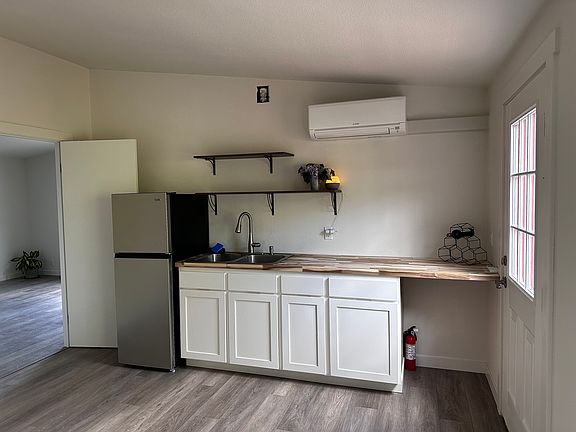 Cozy Kitchenette, new fridge, double sink, electric 2-burner cook top, new microwave, new cabinets, lots of light!