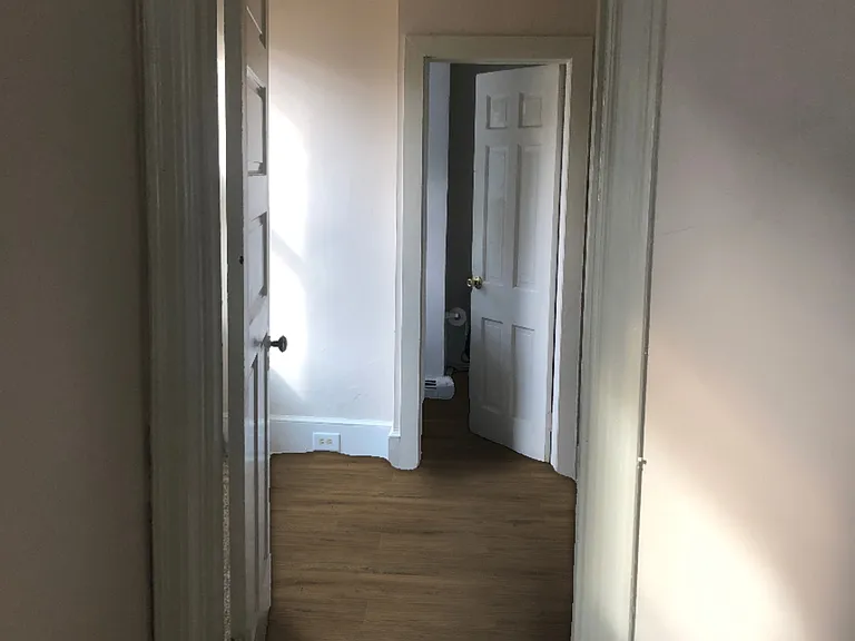 Bedroom with two windows, two large closets, and bathroom