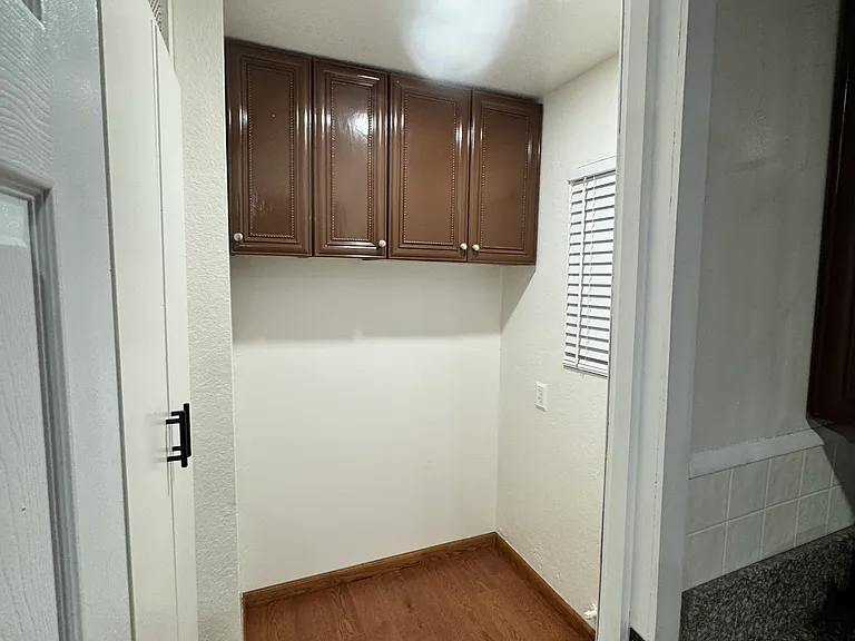 Walk in pantry room/bonus room located in kitchen. Shelving will be hung prior to move in time.