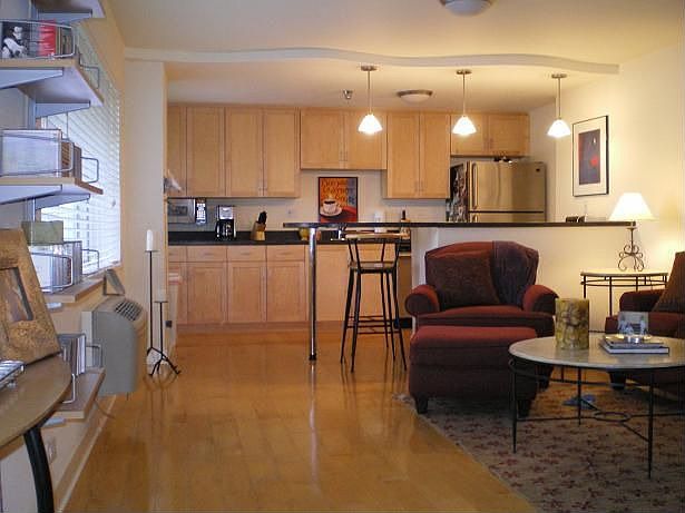 Large living room with beautiful hardwood floors.