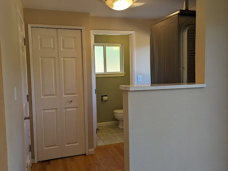 Laundry area, 3/4 bath, linen closet and garage access