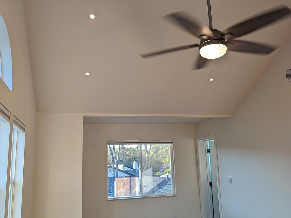 ceiling fan and light in the vaulted ceiling of the M-Bedroom