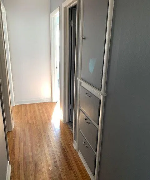Large storage cabinet & drawers just outside the bathroom.