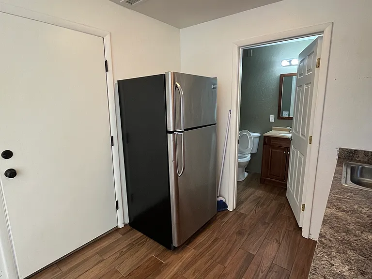 front door, fridge, and bathroom