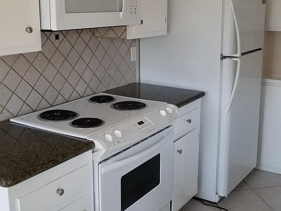 Refinished cabinetry and granite countertops