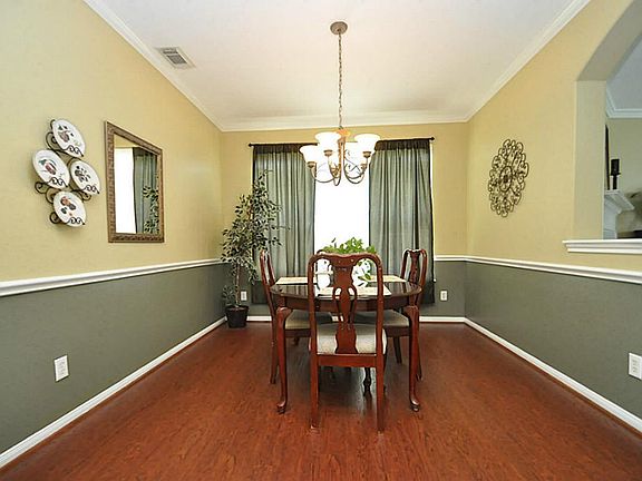 Dining Room: crown moldings, chair railing, laminate wood