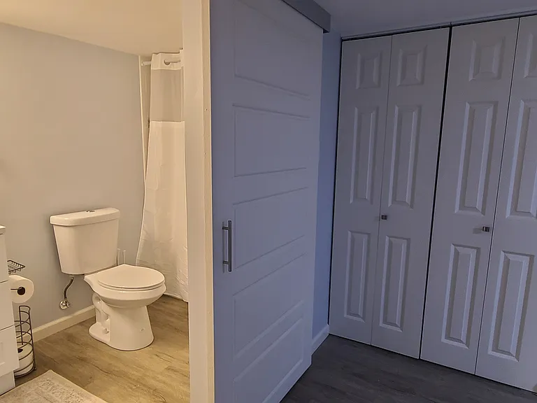 A downstairs full private bathroom attached to Bedroom 3