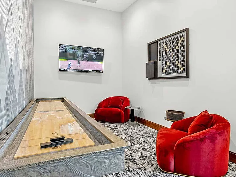 Cozy lounge nooks with game tables create a relaxed setting to unwind, spark a little friendly competition, and enjoy time well spent just steps from home.