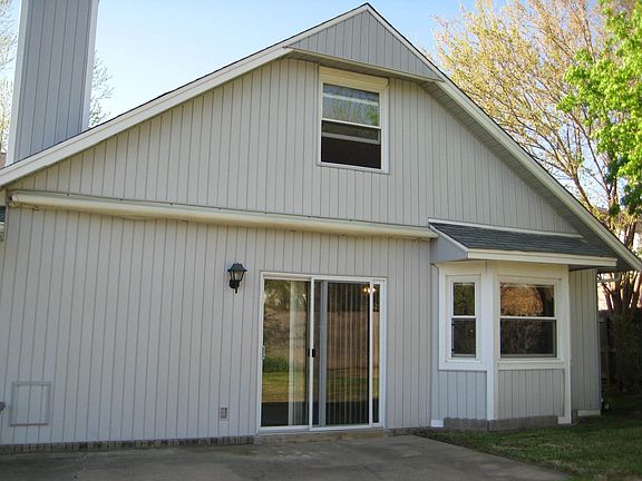 Back of house, awning, bay window, LR Patio door