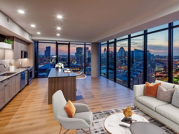 Penthouse-level Signature Collection apartment homes living/dining areas with hard surface flooring throughout
