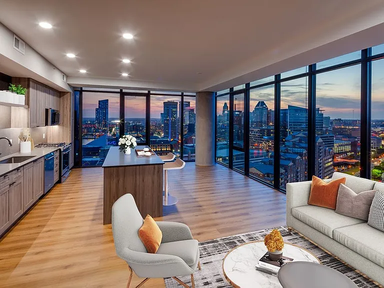 Penthouse-level Signature Collection apartment homes living/dining areas with hard surface flooring throughout