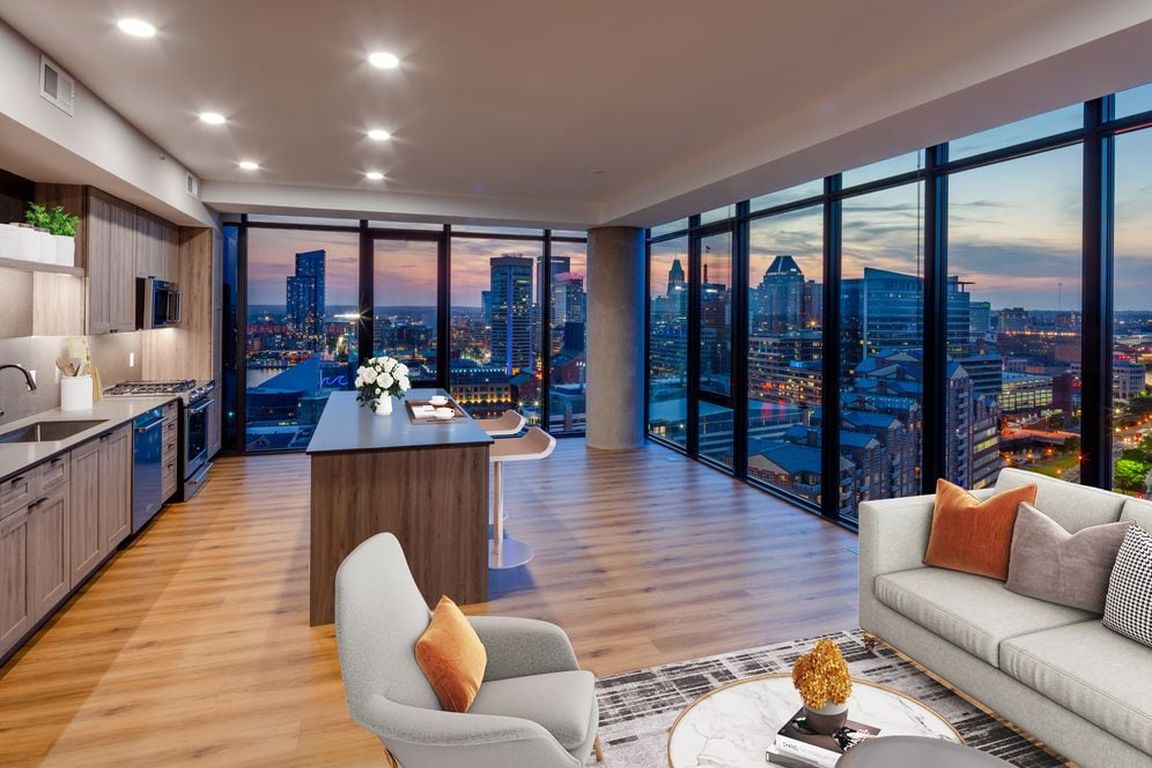 Penthouse-level Signature Collection apartment homes living/dining areas with hard surface flooring throughout