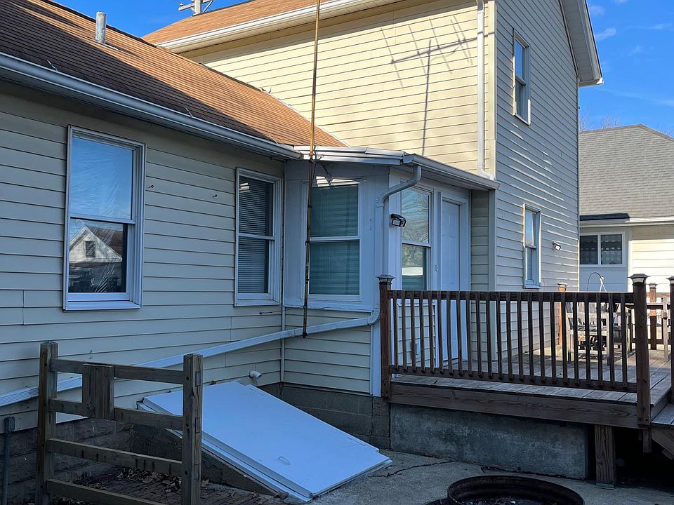 Back of house, cedar deck, outside entrance to basement