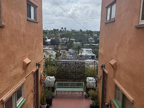 Down the stairs and the door on the left