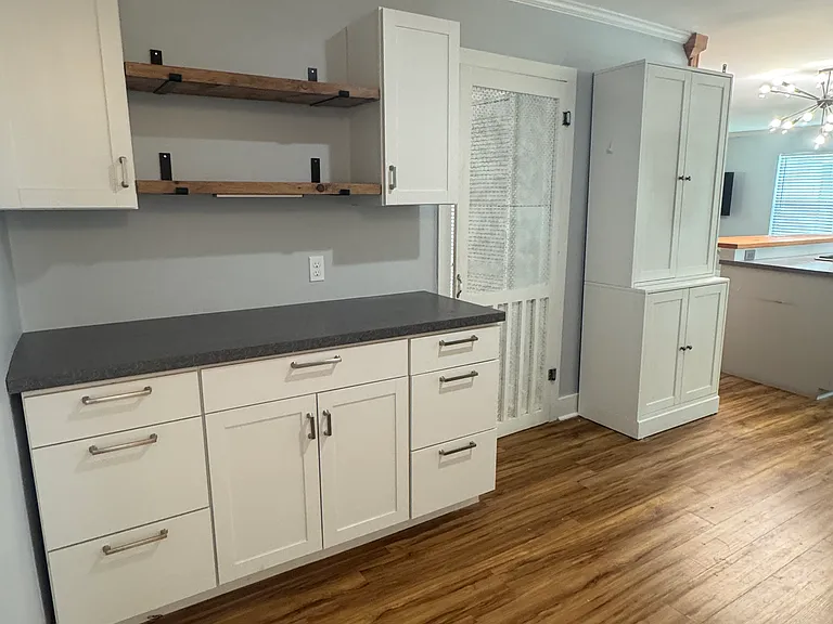 More cabinets leading to storage hallway/laundry room