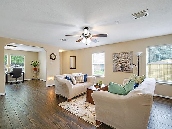 The tile plank flooring looks like hand scraped hardwood! Easy care as well as kid and pet friendly.