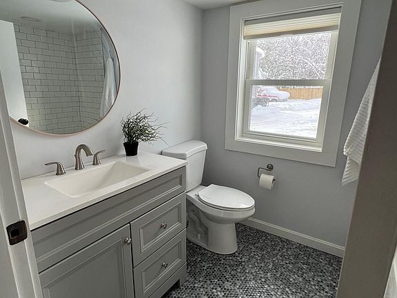 Main floor has a full bath with gorgeous penny tile detail