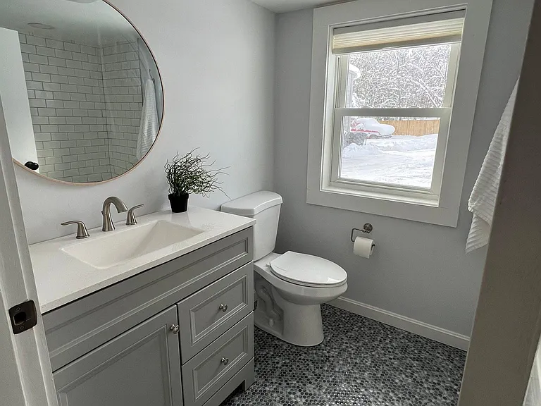Main floor has a full bath with gorgeous penny tile detail