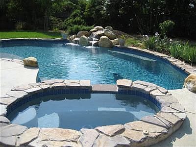 nice rock work all around and an extra large patio area too. 