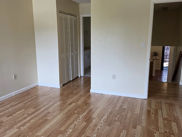 Master bedroom looing towards closets and master bath on left and doorway on right