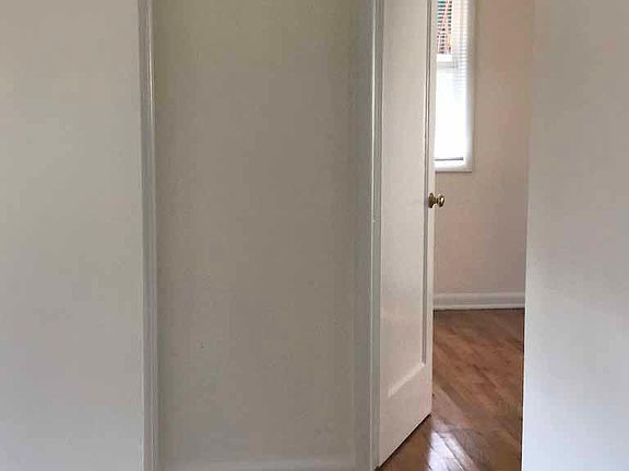 Hallway.Smoke detector. More wood floors... see how they shine?