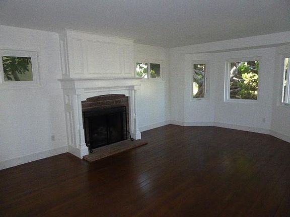 Charming Living Room w/ Hardwood Floors and Shutters on order