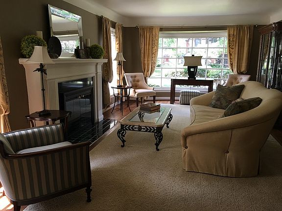 Living Room
						:
						Formal living room w/ large bay window + gas burning fireplace.