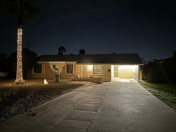 Night view with new palm tree lights, two new motion and daylight sensor entry lights with dual outdoor electrical outlets, new carport long light, 3 Ring spotlight cameras and Ring Doorbell. New solar light shines on house number.