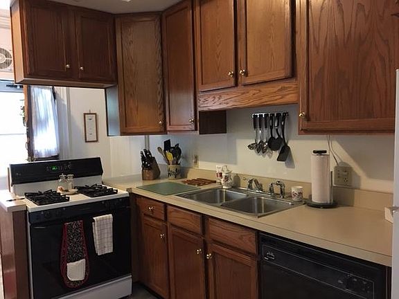 View of Kitchen from Dining Room doorway--gas stove, disposal, dishwasher
