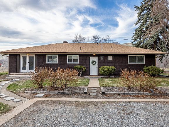 Front entrance with driveway parking.