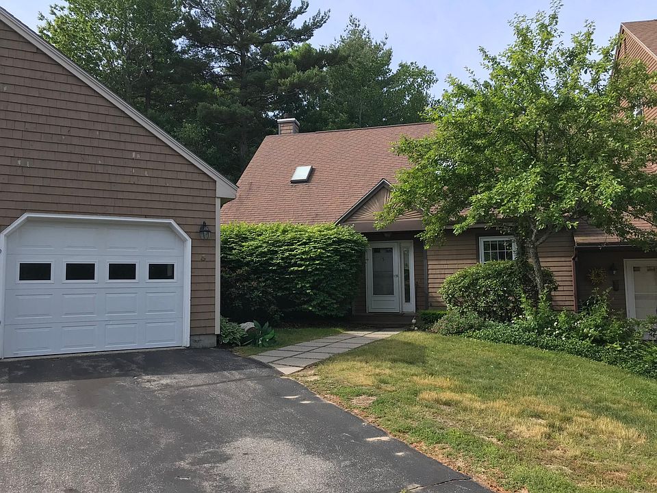 The exterior of the end-unit condo with a one-car garage.
