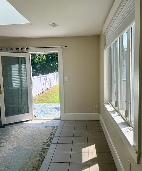 Additional Living Room (only 1/2 room shown here) leading out to fenced-in backyard
~12.5 x 13