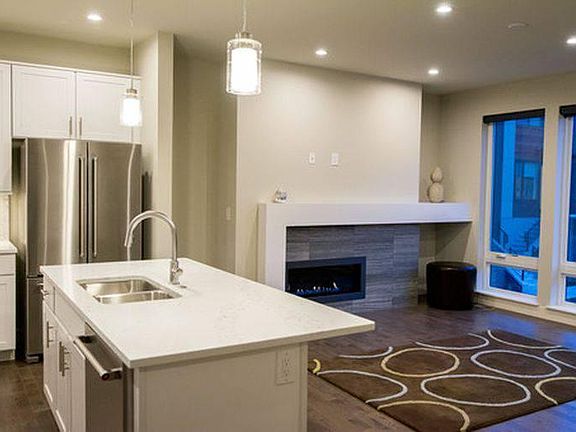 Second level. Designer kitchen and living/entertainment area.