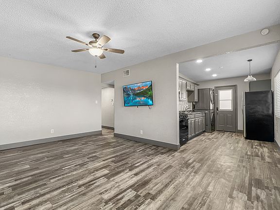 Living room with view of kitchen