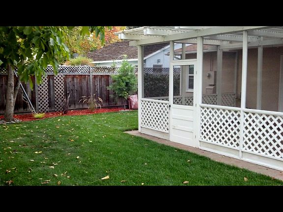 Screened in flagstone patio to enjoy the backyard year round