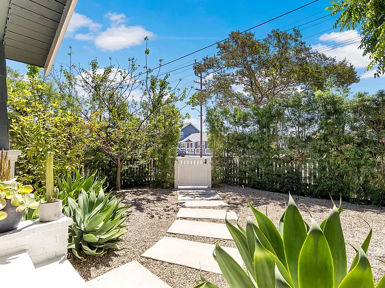 Gated, fenced yard with privacy hedges