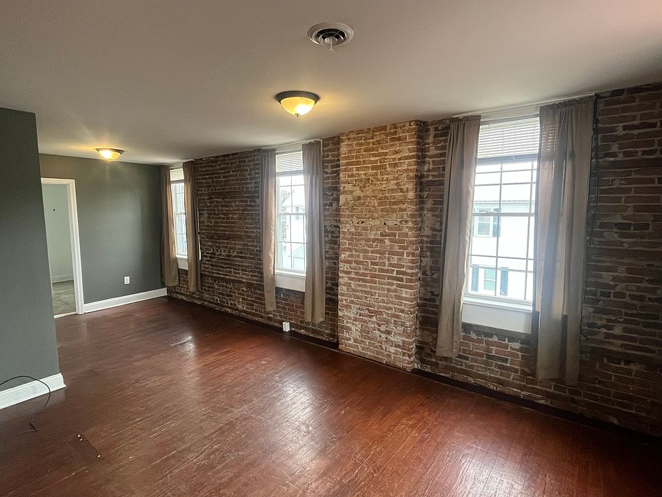 Living Room with exposed brick wall