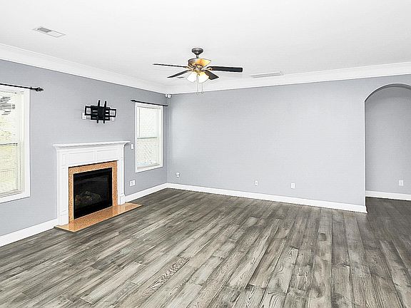 Large Gathering Room with fireplace. Lots of natural light