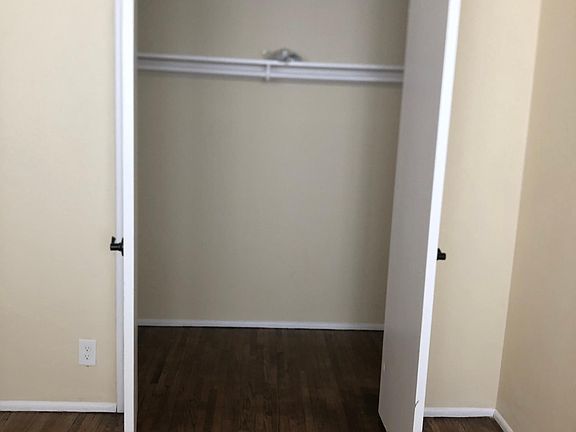 Bedroom 1 looking left and into walk-in closet