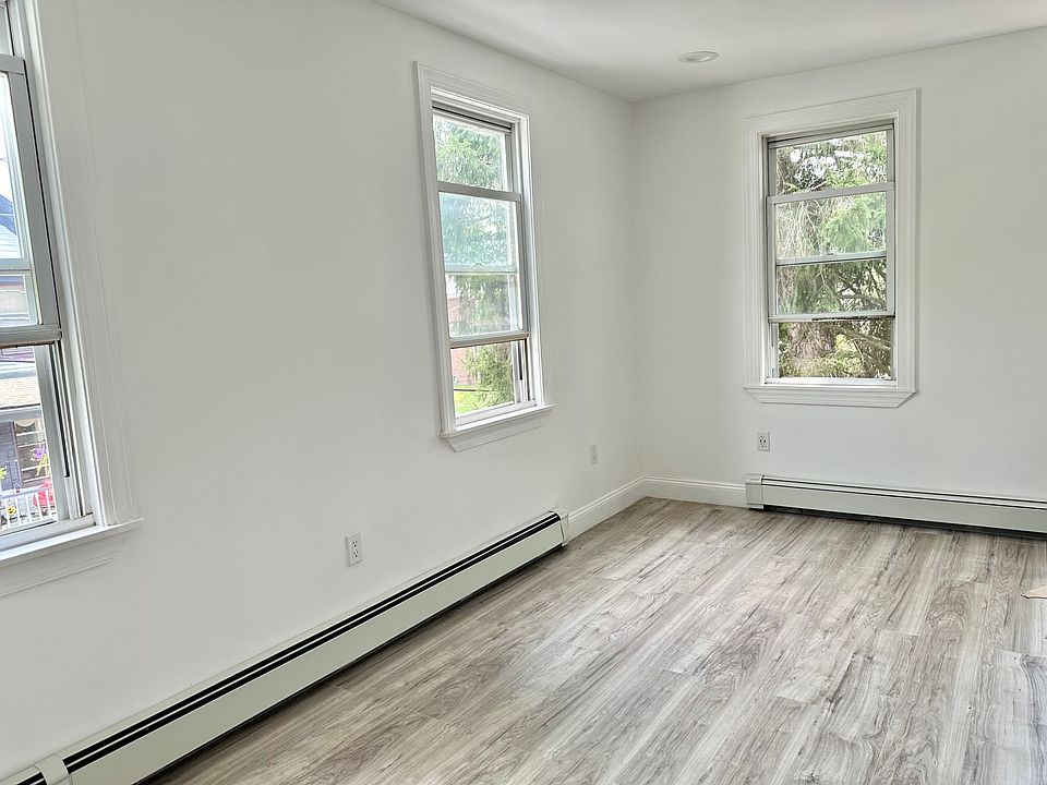 2nd view of one of the large, bright bedrooms.