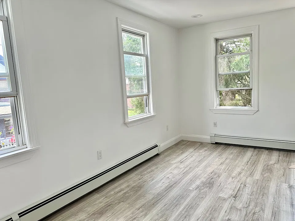 2nd view of one of the large, bright bedrooms.