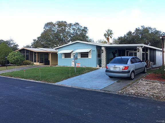 Front of Home w/ Attached Carport