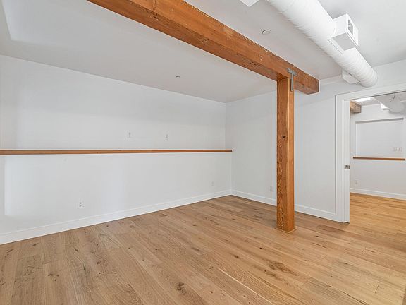 Living Room with reclaimed timber shelf wired for cable