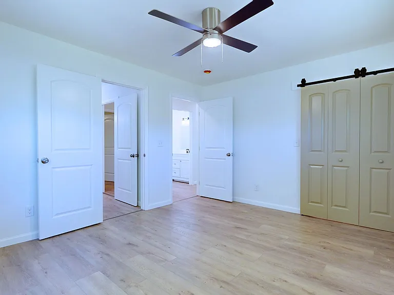 Primary Bedroom - largest bedroom, ceiling fan, large closet, private bathroom.