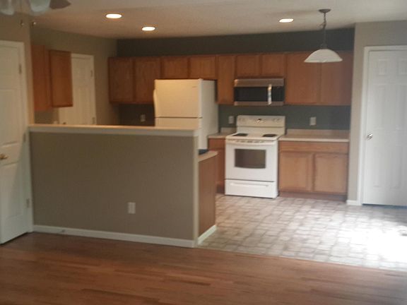 Living room looking into kitchen dining area.