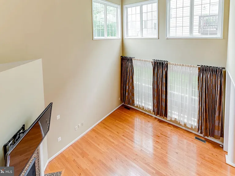 Great Room/ Family Room with 19' cathdral ceiling, lots of windows to let in natural light
