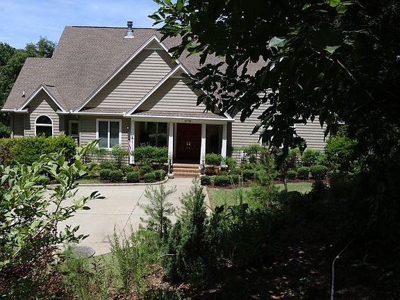 Off-street parking area in front of residence where Hideaway is located